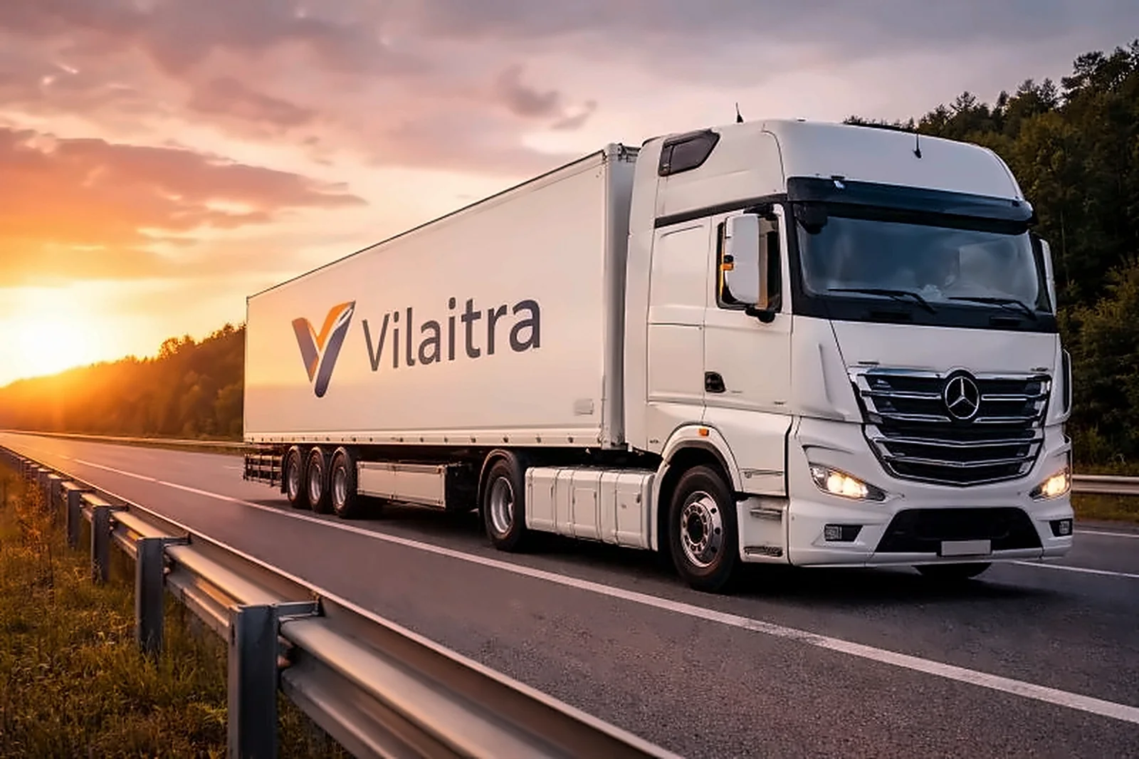 White Vilaitra semi-trailer truck on a motorway at sunset